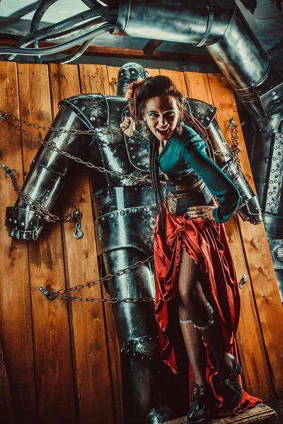 A beautiful woman with the tied male robot. — Stock Photo, Image