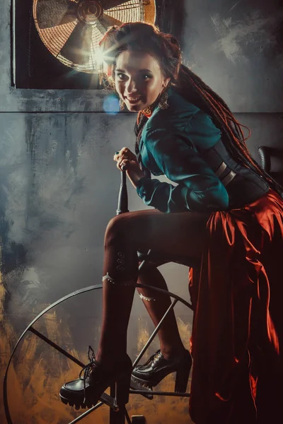 Side shot of attractive woman riding on the spinning bike — Stock Photo, Image