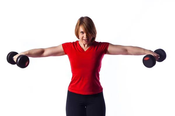 Beautiful fit woman making exercises with dumbbells — Stock Photo, Image