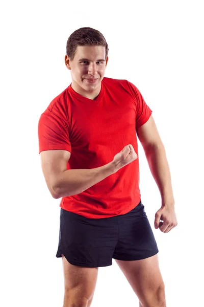 Hombre musculoso posando en el estudio, aislado sobre un fondo blanco — Foto de Stock