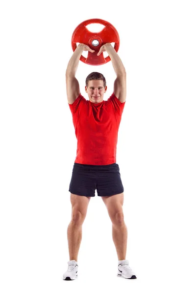Muskulöser Typ, der Übungen mit Kurzhanteln über weißem Hintergrund macht — Stockfoto