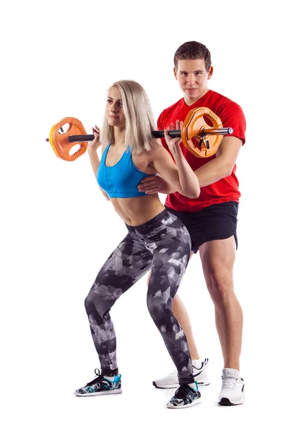 Pár, muž a žena, která dělá cvičení na bílém pozadí izolované — Stock fotografie