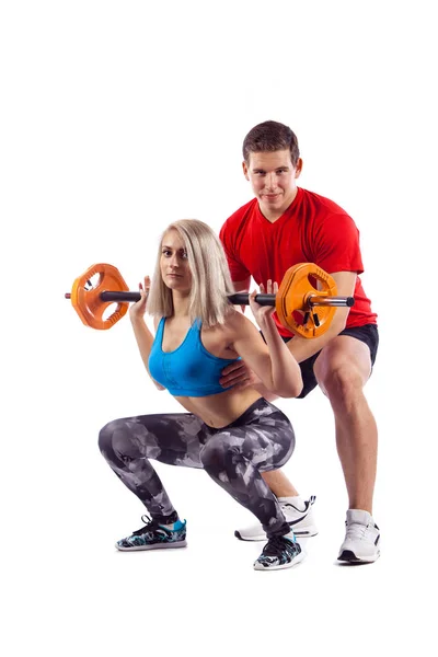 Pár, muž a žena, která dělá cvičení na bílém pozadí izolované — Stock fotografie