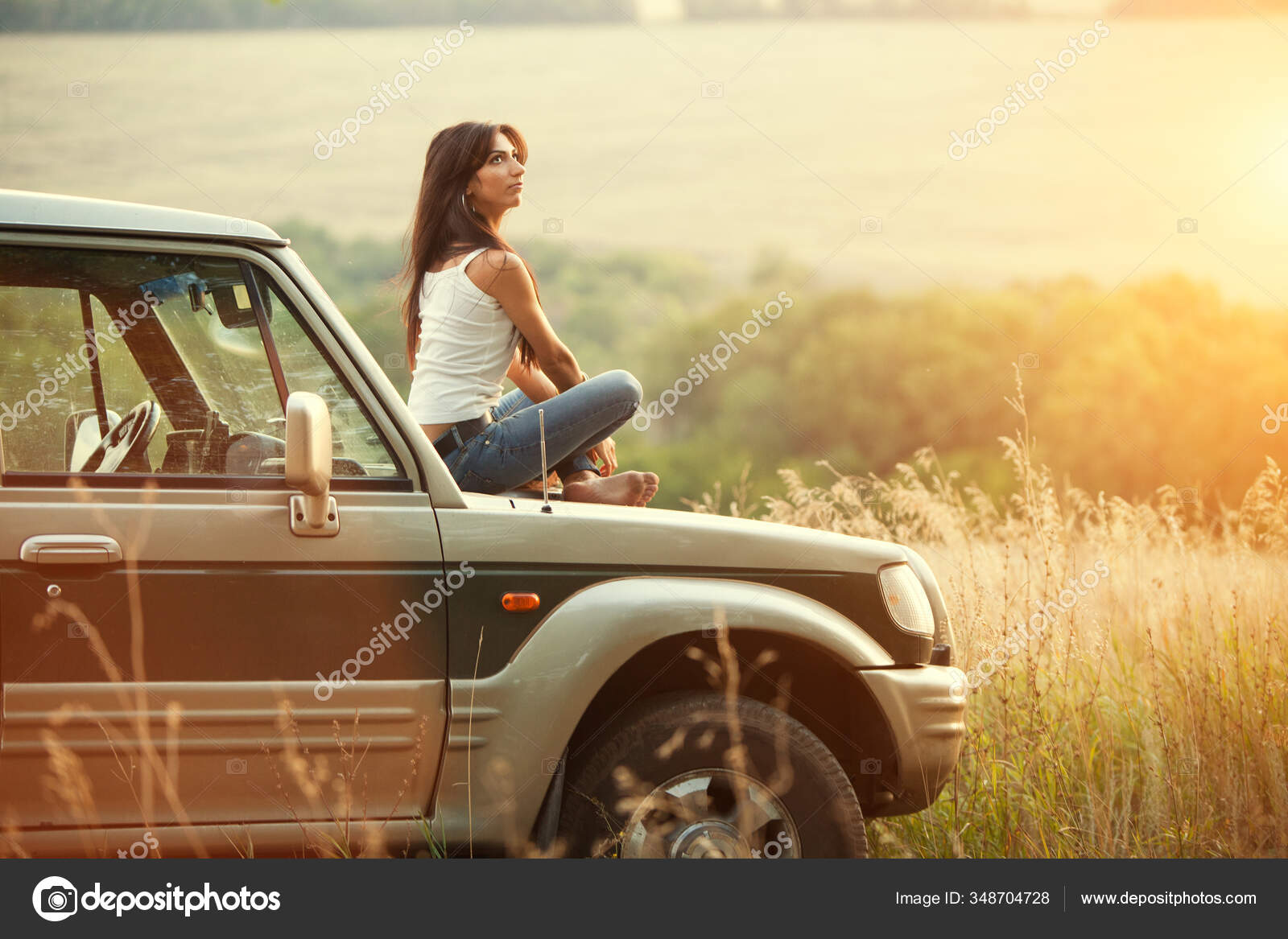 Attractive Yong Woman Sitting Car's Hood Looking Sunset Rural Evening Stock  Photo by ©bigdan 348704728