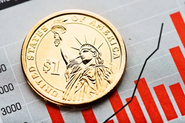 One dollar coin on fluctuating graph. — Stock Photo, Image