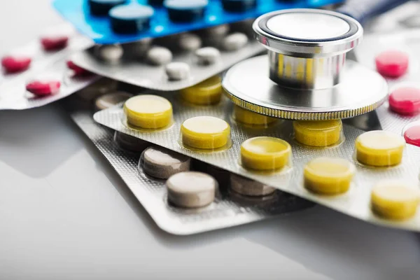 Stethoscope and different pills — Stock Photo, Image