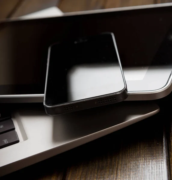 Laptop with smartphone and tablet — Stock Photo, Image