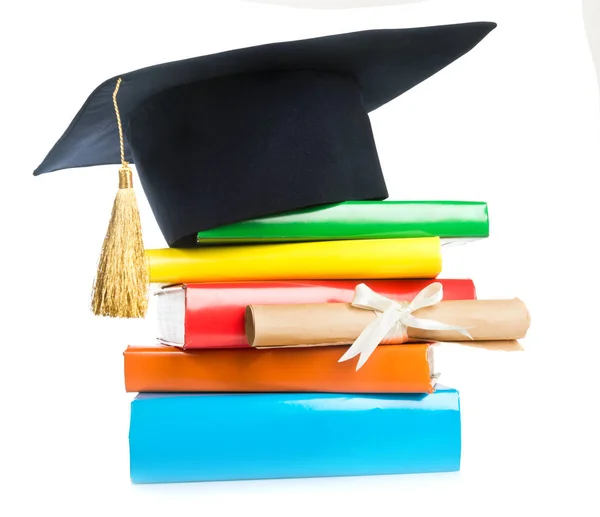 Mortarboard and graduation scroll — Stock Photo, Image