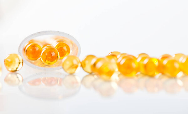 shiny yellow fish oil capsules
