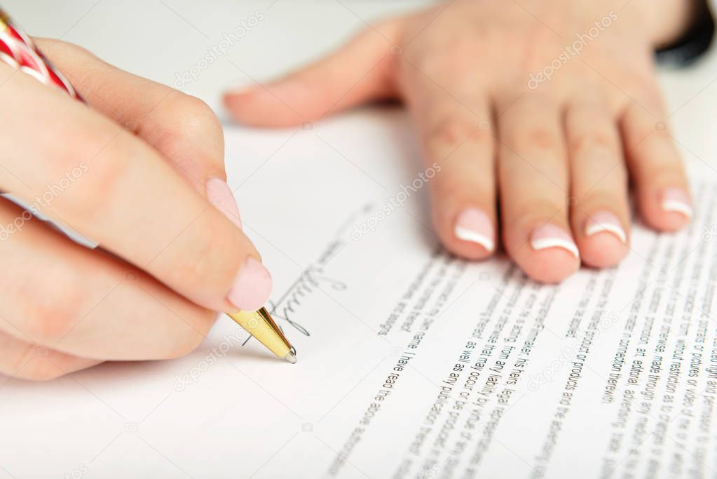 woman signing contract