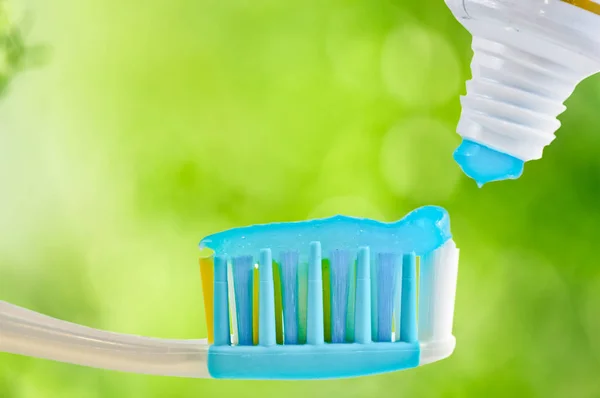 Dental brush and tube with paste — Stock Photo, Image