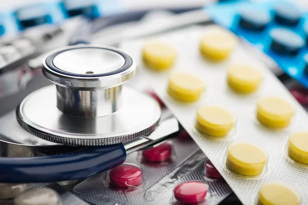 Stethoscope and different pills — Stock Photo, Image