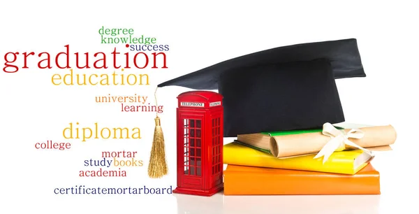 Stack of books with mortarboard and vintage scroll — Stock Photo, Image