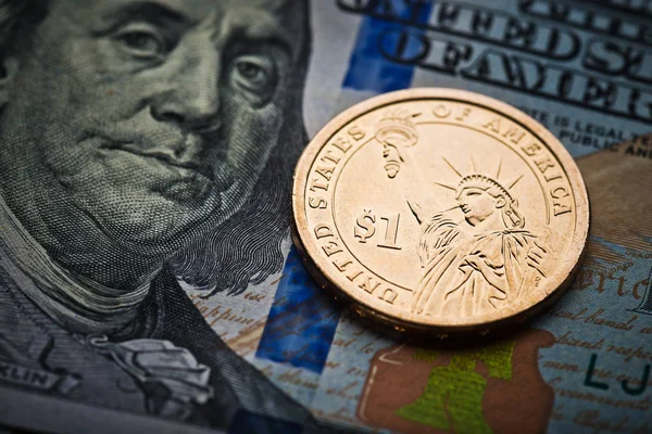 Coin on american banknote Royalty Free Stock Images