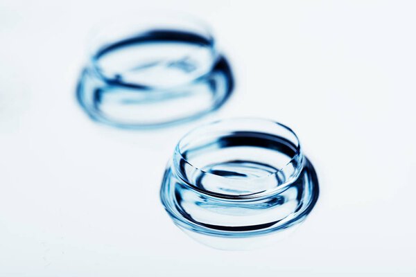 Two contact lenses with reflections