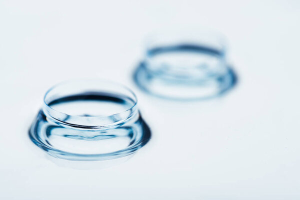 Two contact lenses with reflections