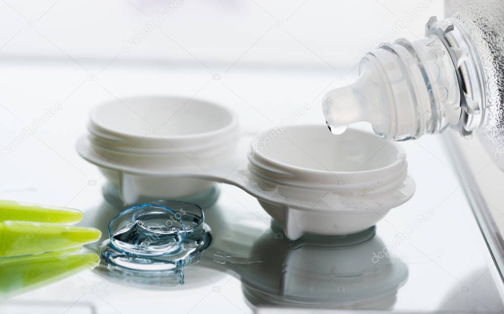 Contact lens, case and bottle of solution 
