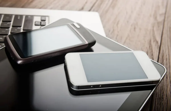 Keyboard Two Phones Tablet Wooden Desk — Stock Photo, Image