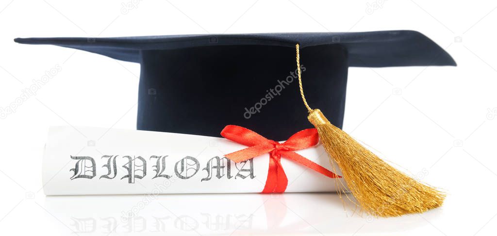 Graduation hat and Diploma on white surface