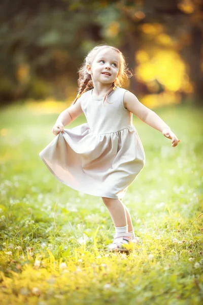 Funny girl on sunny meadow Royalty Free Stock Photos