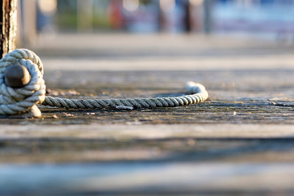 Rope on wooden jetty