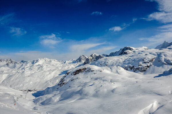 Alpine winter mountain landscape. French Alps with snow. 