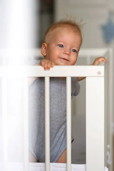 Baby boy in crib — Stock Photo, Image