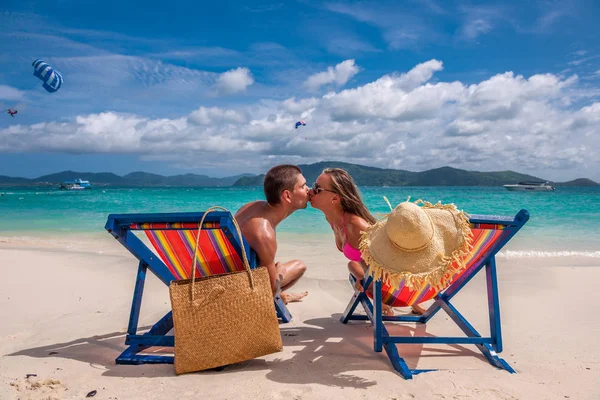 https://st3.depositphotos.com/1000970/14183/i/450/depositphotos_141837374-stock-photo-couple-on-tropical-beach.jpg