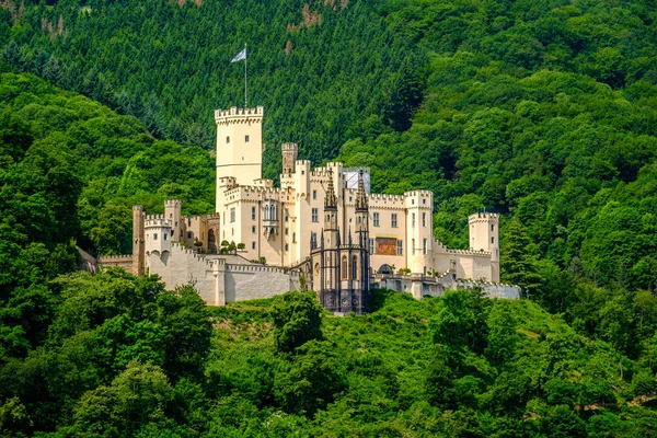 Castle in bright green woods — Stock Photo, Image
