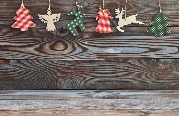Christmas decorations hanging on wood — Stock Photo, Image