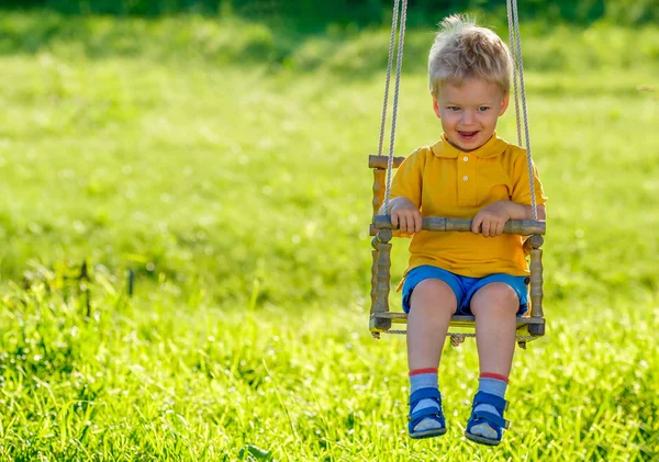 Baby boy on swing — Stock Photo, Image