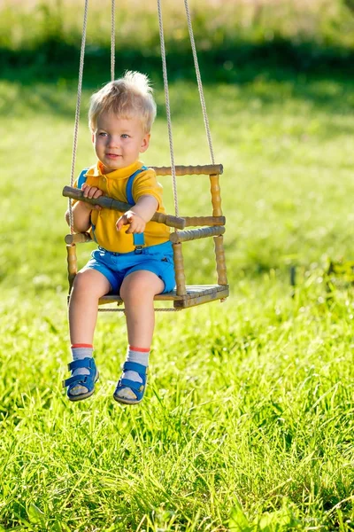 Baby boy on swing — Stock Photo, Image