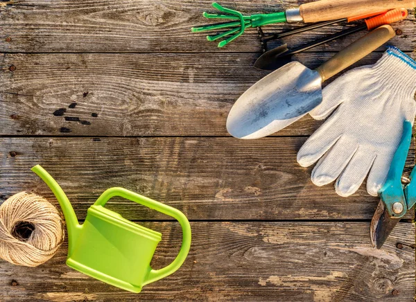 Gardening tools and watering can — Stock Photo, Image