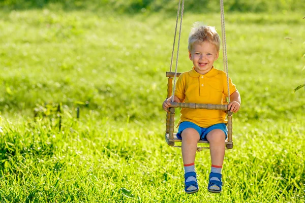 Baby boy on swing — Stock Photo, Image