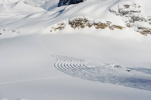 Alpine winter mountain landscape. French Alps covered with snow in sunny day. Val-d'Isere, France