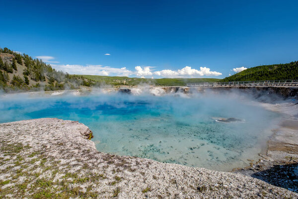 Hot thermal spring Excelsior Geyser Crater near Grand Prismatic Spring in Yellowstone National Park, Wyoming, USA