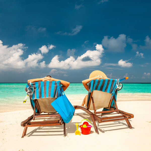 Couple on a tropical beach at Maldives