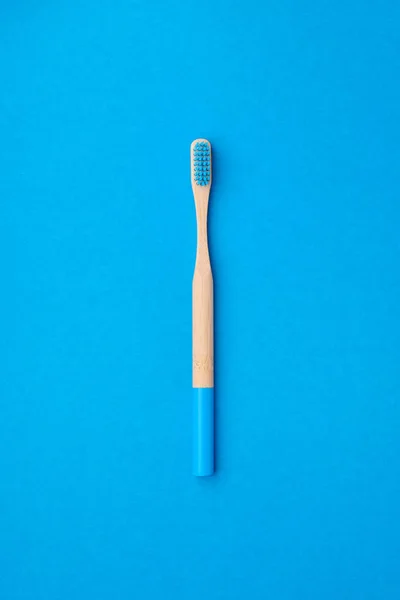 Toothbrush on blue background top view — Stock Photo, Image