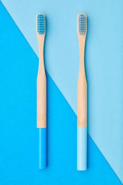 Toothbrushes on blue background top view — Stock Photo, Image