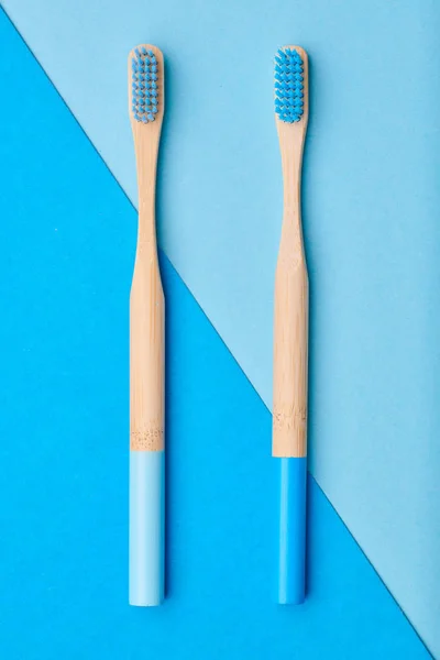 Toothbrushes on blue background top view — Stock Photo, Image