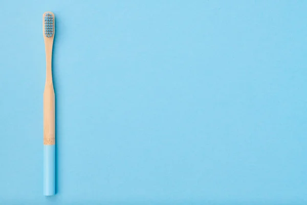 Toothbrush on blue background top view — Stock Photo, Image