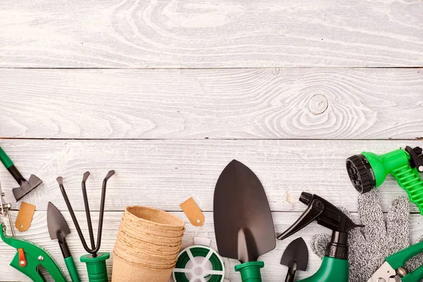 Gardening tools on wooden background flat lay — Stock Photo, Image