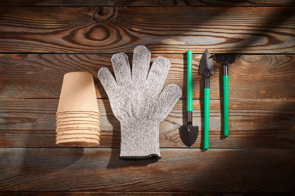 Gardening tools on wooden background flat lay — Stock Photo, Image