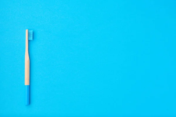 Toothbrush on blue background top view — Stock Photo, Image