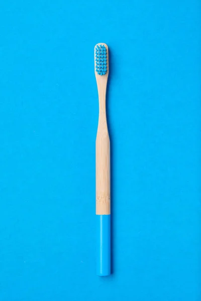 Toothbrush on blue background top view — Stock Photo, Image