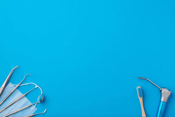 Dentist tools over blue background top view — Stock Photo, Image