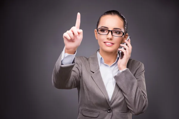 Businesswoman pressing virtual buttons in business concept — Stock Photo, Image