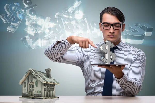 Young handsome businessman in mortgage concept — Stock Photo, Image