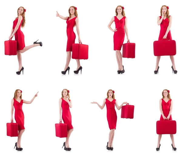 Jeune femme en robe rouge avec valise isolée sur blanc — Photo