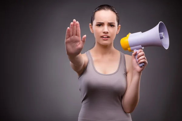 Woman in sports concept with loudspeaker — Stock Photo, Image